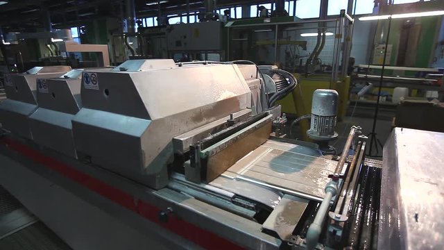 Ceramic tiles manufacturing. Porcelain stoneware and ceramic tile factory, from inside. Production processes.