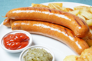 Grilled sausages with ketchup