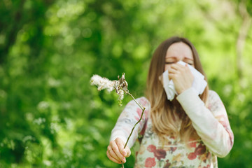 young woman suffering spring pollen allergy