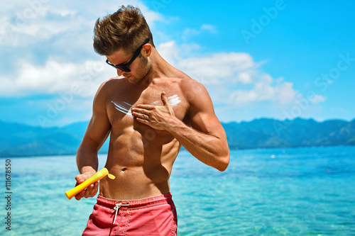 Man Skin Care In Summer Handsome Male With Y Body Sungles Man Skin Care In Summer Handsome Male With Y Body Sungles Lying Uv Protective