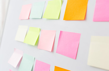 close up of blank paper stickers on white board