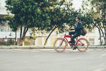 female riding vintage bicycle in park 