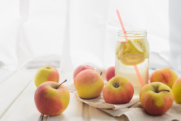 fresh rustic concept, apples on a white rag on the wooden background