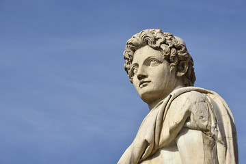 Fototapeta na wymiar Dioskouri (with copy space). Ancient roman statue of Dioskouri at the top of Capitoline Hill staircase and balustrade, in the center of Rome (1st century BC)