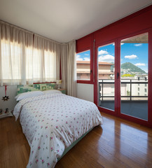 master bedroom of vintage apartment with parquet