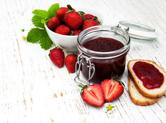 Strawberry jam and fresh strawberries