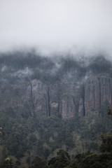 clouds rest on the mountains