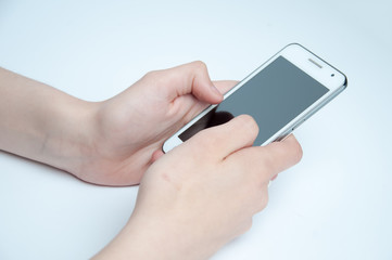 Girl holding a white smartphone. White background