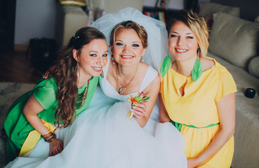 Funny photo of the bride and bridesmaids in the room