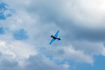 Aerobatics in the blue sky with clouds