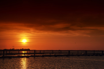 Fototapeta na wymiar Harbor without ships at sunset