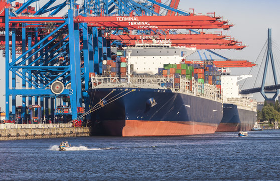 David and Goliath; Container Port at Hamburg in the Light of the setting sun