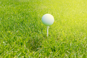 Golf ball on tee ready to be shot