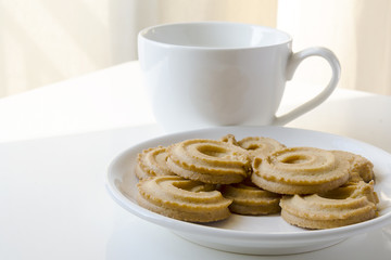 Butter cookies with cup of tea