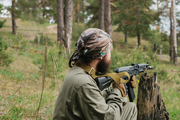 Armed man in a zone of armed conflict