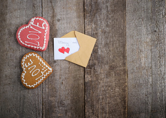 Cookie in shape of heart isolated on white background  on wooden background. top view