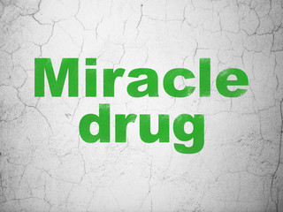 Medicine concept: Miracle Drug on wall background