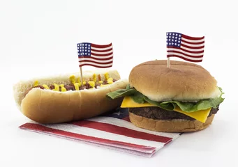 Poster Hot dog and Hamburger on an American flag napkin and toothpick © excaliburmedia