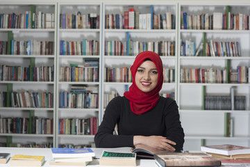 Portrait of handsome young student in the library