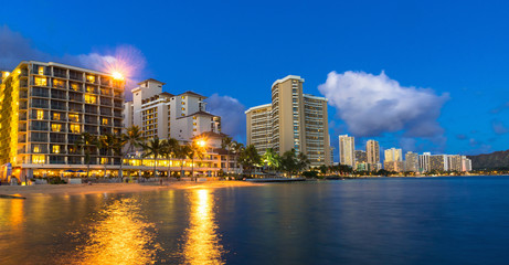 Beachfront hotels on Waikiki beach in Hawaii at night