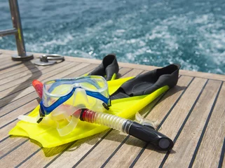 Foto op Canvas Snorkeling equipment on the deck of a motor boat © Paul Vinten