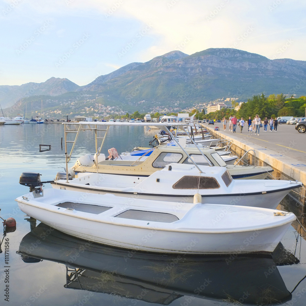 Poster boats in the in the bay of bar, montenegro