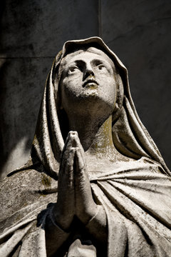 Praying sculpture on the cementary Recoleta, Buenos Aires