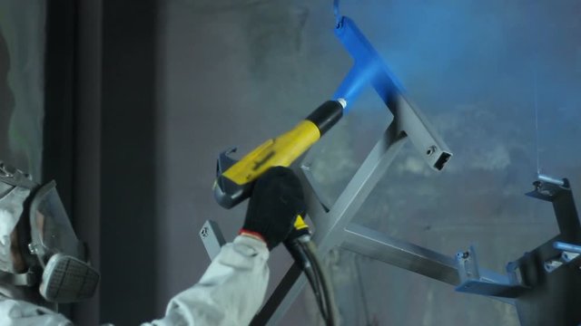 Powder coating of parts at the factory