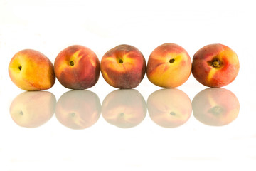 Peaches on a white background
