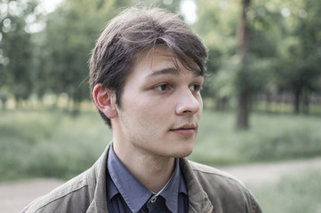 portrait of a young man with brown eyes in the Park