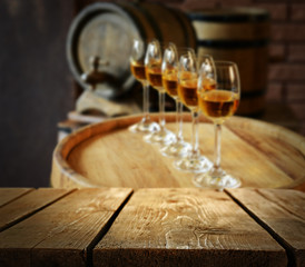 Barrels of wine and empty wooden desk
