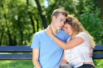 Fototapeta premium young man comforting his girlfriend 