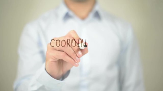 Coordination, Man writing on transparent screen