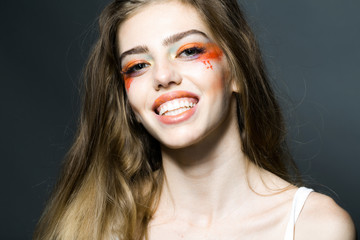 Girl with orange makeup closeup