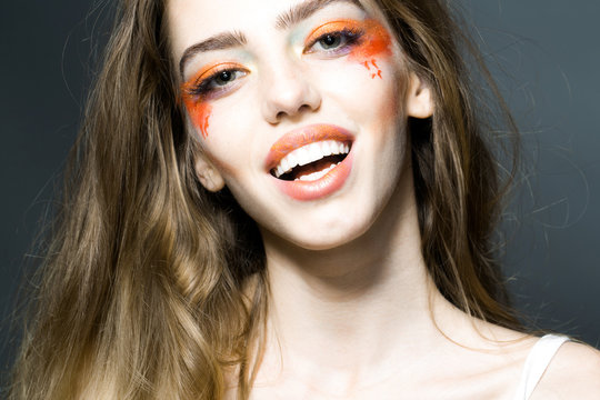 Girl with orange makeup closeup