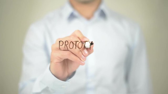 Prototyping , Man writing on transparent screen