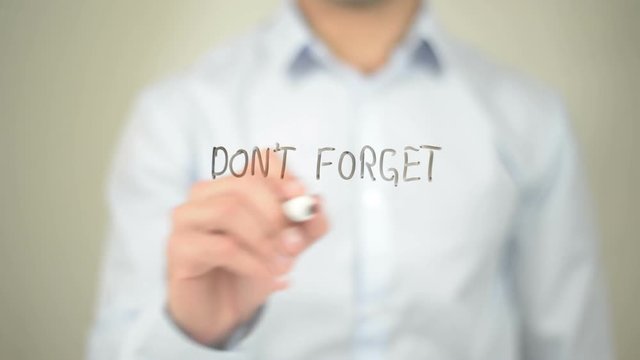 Don't Forget to be Awesome, Man writing on transparent screen