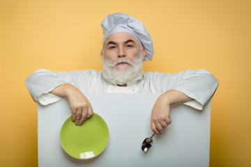 Bearded cook with paper spoon and plate