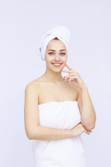 young beautiful woman wrapped in towel