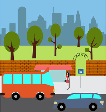 Girl waiting for the bus at the city bus stop
