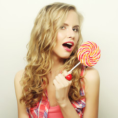 blond  girl with  lolipop