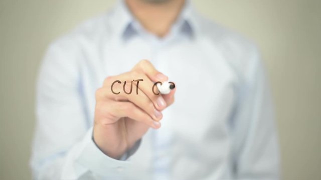 Cut Cost, Man writing on transparent screen