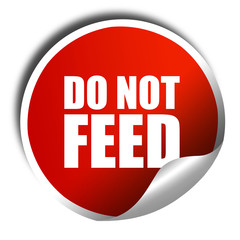 do not feed, 3D rendering, a red shiny sticker