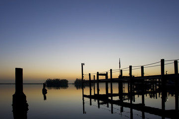 Fototapeta na wymiar A large dock at dusk after a calm sunset.