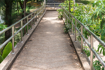 Modern walkway bridge with metal railing.