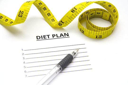 sheet of paper with diet plan and pen