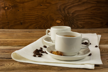 Coffee cups served on the linen napkin