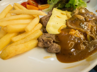 Grilled beef steak with cheese