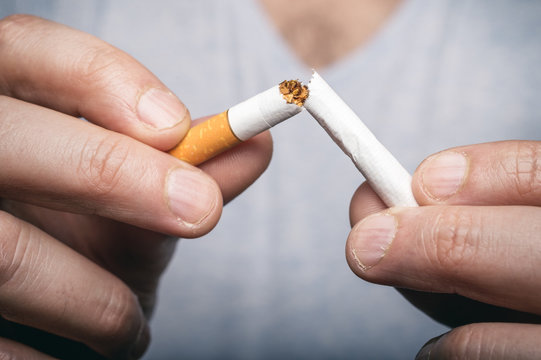 Quit smoking - male hand crushing cigarette