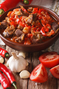 Arabic cuisine: lamb stew with vegetables close up in a bowl. Vertical
